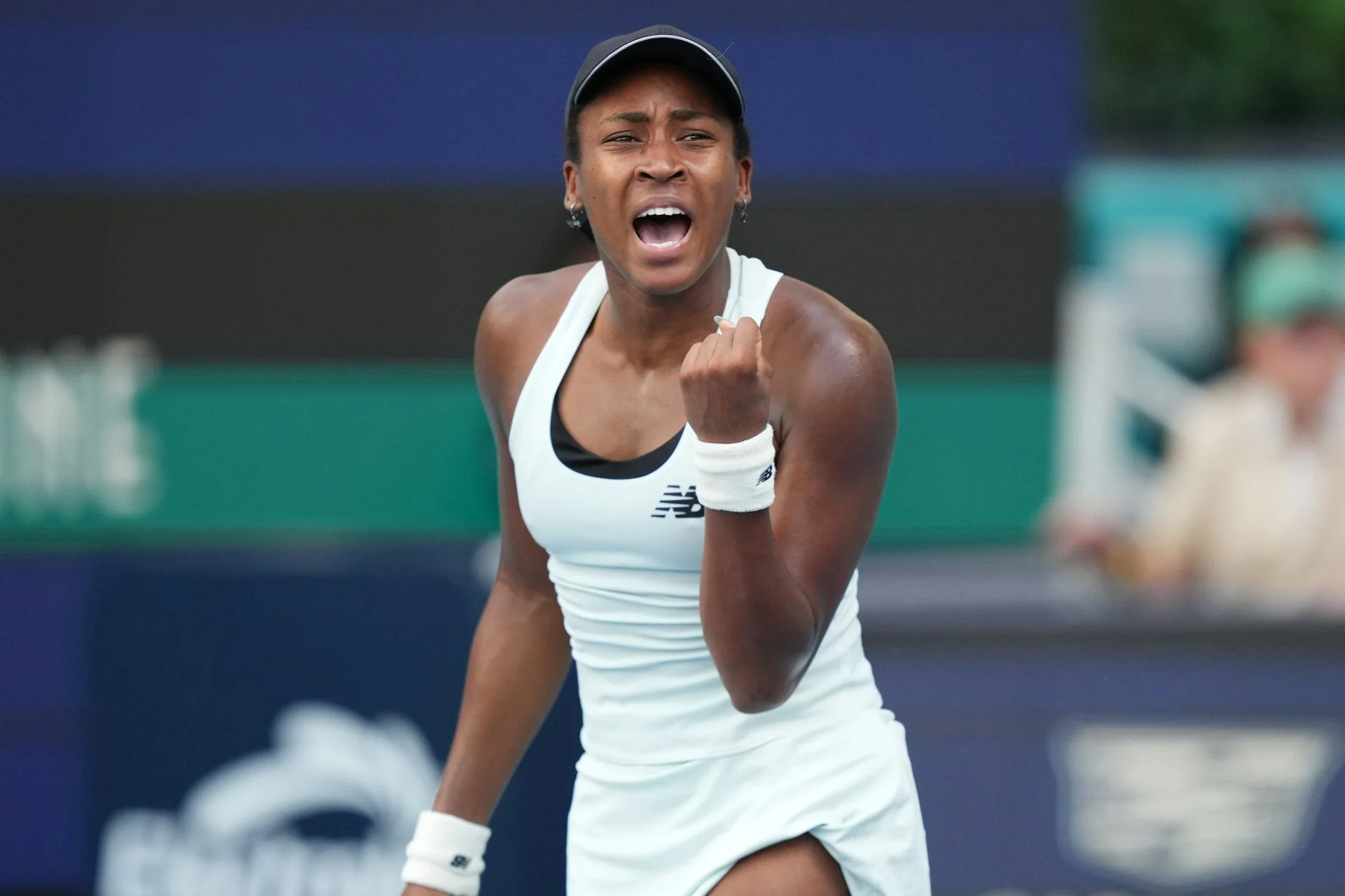 Tennis player Coco Gauff pumps her fist with joy after winning a point against Karolina Muchova at the Miami Open tennis tournament.